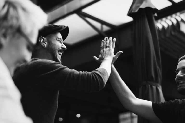 Friends giving a high five