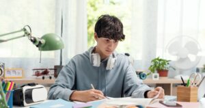 Teenager studying at home alone